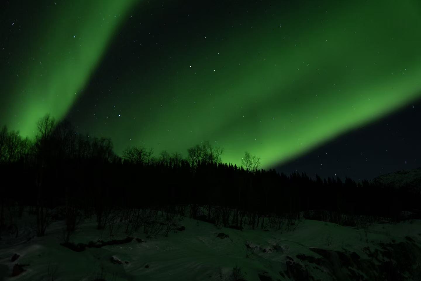 Aurora ribbon across the fjord